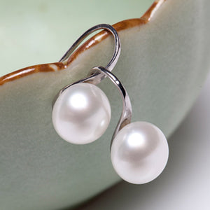 Navy-themed earrings with pearls